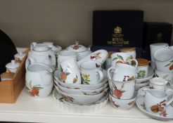 A large collection of Royal Worcester Evesham dinner, tea and oven ware including two spice racks,