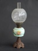 A 19thC oil lamp with painted glass
