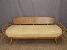 Retro Ercol light elm sofa or day bed raised on splayed tapering legs,