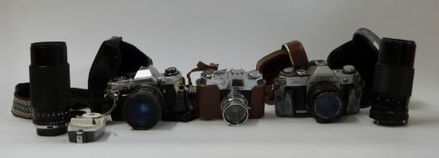 Olympus OM10 with Tamron 1:3.5-4.5 28-50mm lens, Canon AE1 with 50mm 1:1.