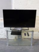 A flat screen Panasonic television and accessories