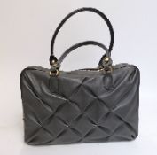 Smythson of Bond Street black leather handbag with quilted effect to the sides and iPad pocket