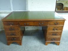 Leather inset twin pedestal desk with three drawers to the top and three to each pedestal,