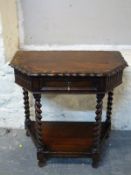 An oak side table with single drawer and shelf below,