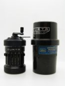 Curta Type I calculator No 68504 in plastic case with left hand thread,