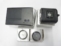 Hasselblad A12 film back 30147 number UE 3145129 together with a Polaroid film magazine 30198 and