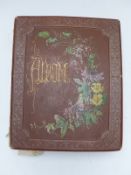 A Victorian scrap and postcard album c1890 including silks, animal, greetings,