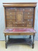 A 19thC oak chest or desk on stand with brush slide and several secret drawers,