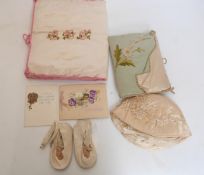 A collection of embroidered and other christening gifts, baby's kid shoes,