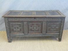 An 18thC carved four panel oak coffer with initials R S,