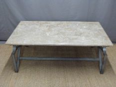 A marble topped and wrought iron coffee table,