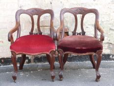 Two Victorian upholstered mahogany armchairs