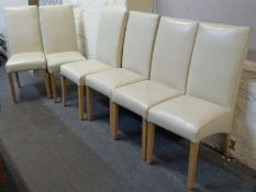 Six contemporary cream dining chairs