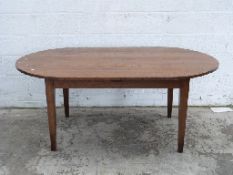 An oval oak dining table,