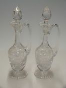 A pair of cut glass ewers