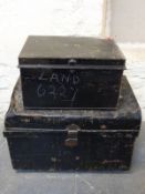 A dome topped metal steamer or travelling trunk together with a smaller metal box,