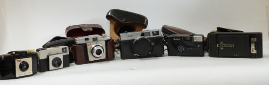 Quantity of various cameras including Kodak folding example, Canon Canonet,