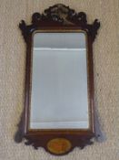 Regency period mahogany framed mirror with inlaid shell, carved detail on phoenix,