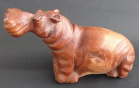 A carved African hardwood hippo,