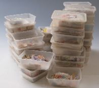 A substantial accumulation of loose stamps, mainly sorted by country into plastic boxes,