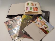 An album of Machin stamps including high value, a ring binder of prestige booklets,