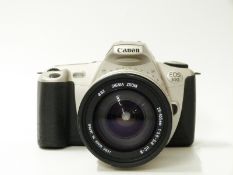 Canon EOS 300 SLR camera with Sigma zoom lens 28-105mm 1:3.8-5.