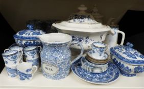 A collection of blue and white ceramics to include tureens, tea, coffee and sugar jars,