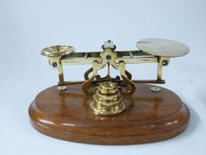 S Mordan & Co brass postage scales on wooden base with weights,