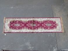 Zrabi/persian fire wool runner on red ground,