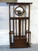 Oak mirror back hall stand with central seat,
