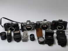 A quantity of SLR cameras and accessories including Minolta 5000, Cosina CSM, Canon EOS 300X,