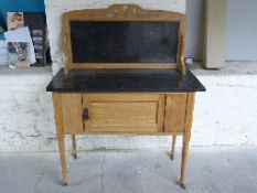 A washstand with marble back and top,
