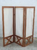 Three fold hardwood screen with canvas panels,