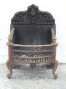 Cast iron fire grate with integral shaped back,