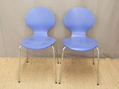 A pair of retro style chrome and painted plywood chairs
