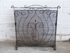 A blacksmith made iron fire guard,
