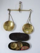 Two sets of 19thC travelling beam scales, one brass, width 22cm the other in a case with weights,