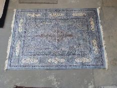 Persian rug with light blue ground and cream guls,
