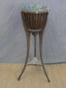 A 19th/ early 20thC jardiniere stand with copper fluted bowl,