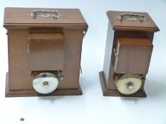 A pair of telephone bell boxes