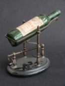 A novelty mechanical wine bottle pourer