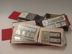 Nine GB presentation pack albums,