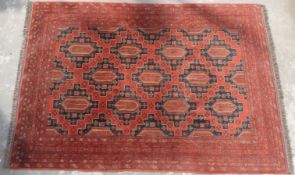 Turkoman large rug on a wine ground,