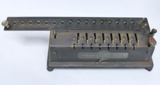 TIM mechanical calculator sold by Times-into Co Chicago with original cover