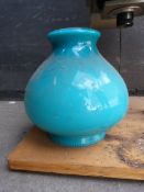 A photographic enlarger and a glass lampshade