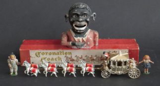 Boxed Lesney coronation coach and a novelty negro moneybox