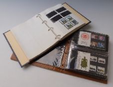 Two albums of GB presentation packs and QEII gutter pairs