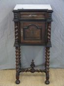 A marble-topped pot cupboard