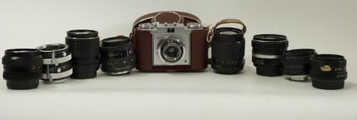 A quantity of camera lenses including Cosina and Pentax 135mm 1:3.5, Konica Hexanon AR 50mm F1.