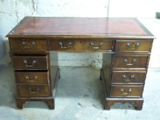 Leather inset twin pedestal desk with three drawers to the top and three to each pedestal,